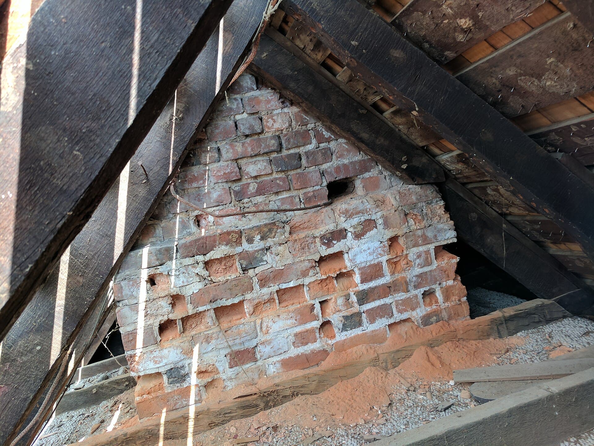 Crumbling brick and mortar inside an old chimney